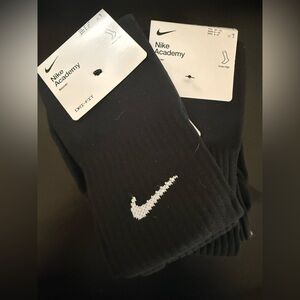 Nike Black Knee-High Socks with White Swoosh - Academy